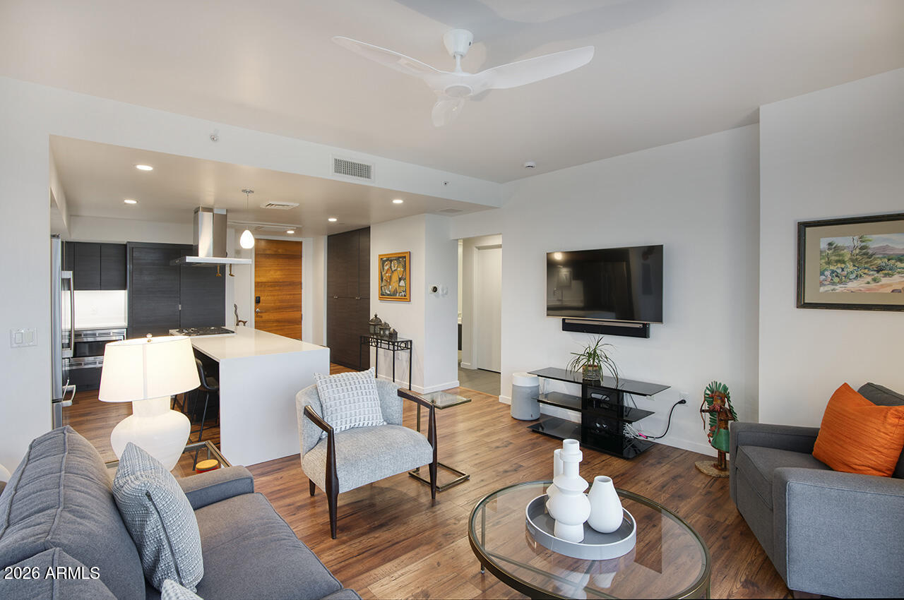 200 West Portland Street, Unit 822 Phoenix, AZ 85003 - Photo 16 of 61 a living room with furniture and a flat screen tv