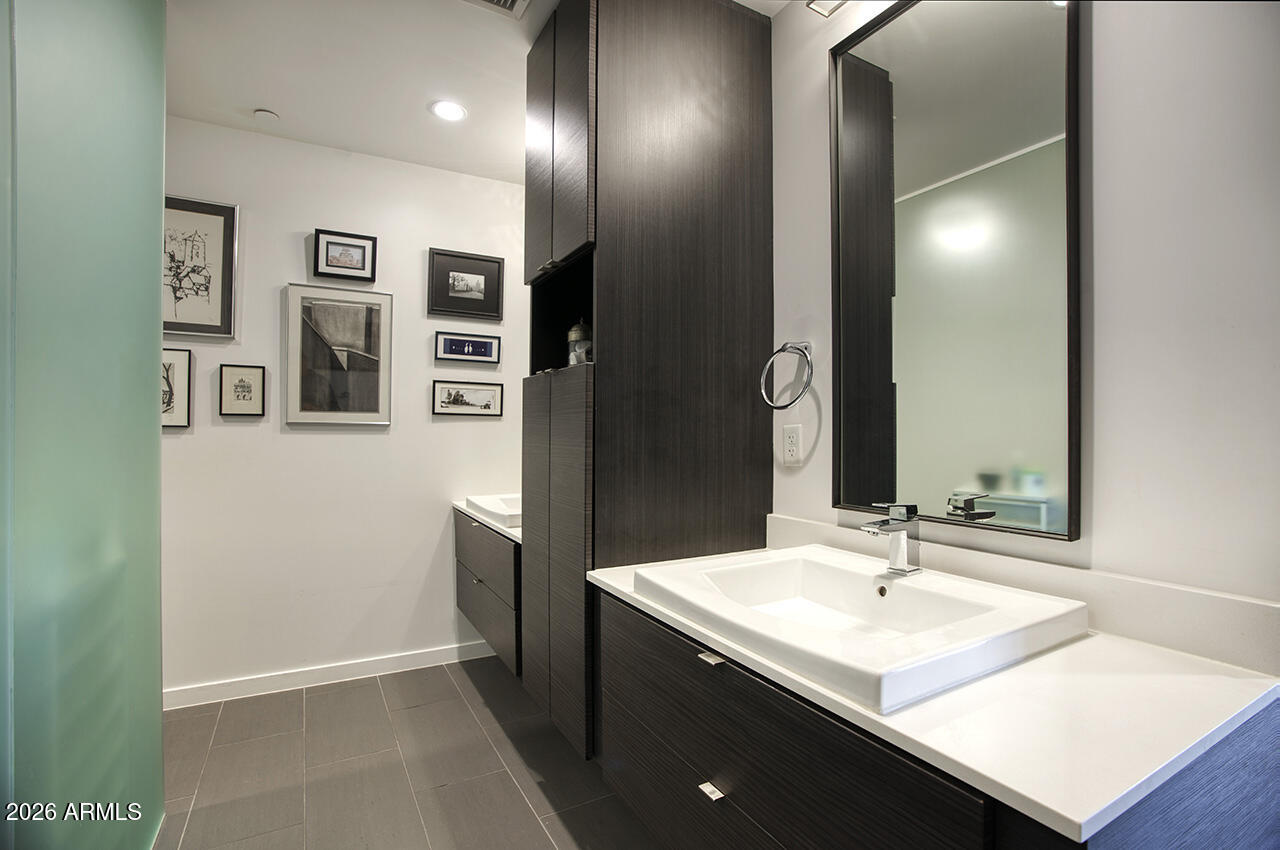200 West Portland Street, Unit 822 Phoenix, AZ 85003 - Photo 26 of 61 a bathroom with a sink double vanity and a mirror