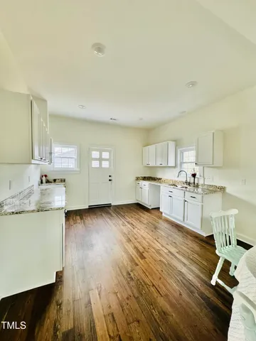 a view of cabinets with wooden floor