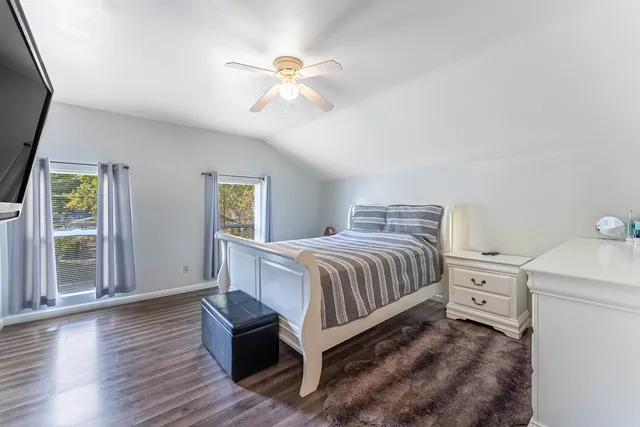 a bedroom with bed and a bookshelf