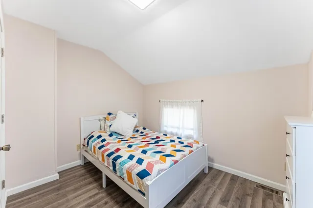 a utility room with dryer washer and a view of living room