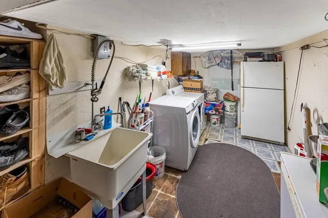 a view of balcony with chairs and wooden fence