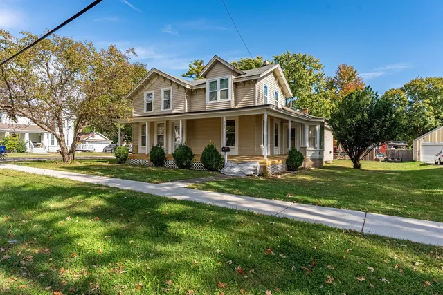 a front view of a house with a yard