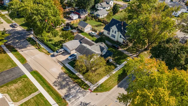 a living room with furniture a large window and a flat screen tv