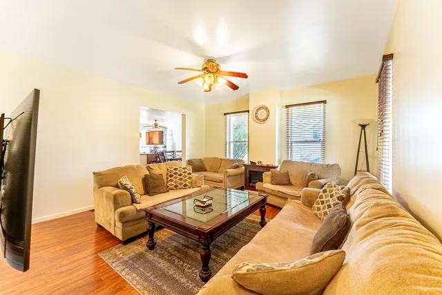 a view of a dining room with furniture and wooden floor