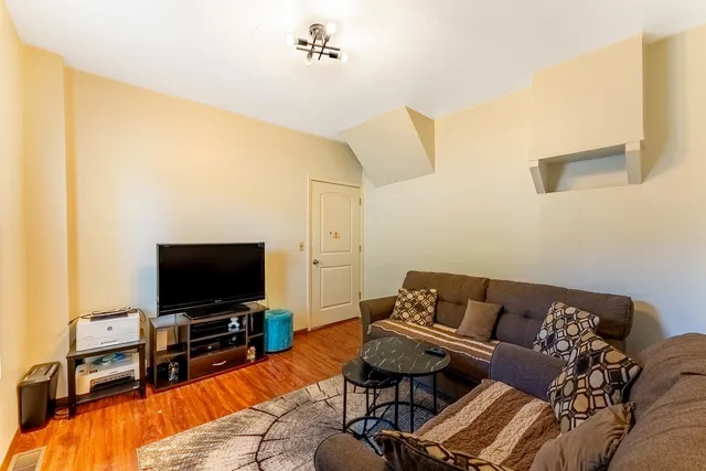 a bedroom with a bed and dresser