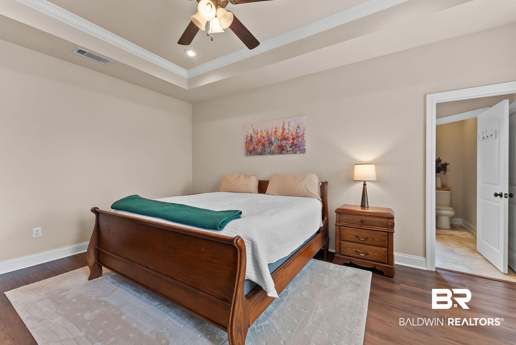 7015 Rocky Rd Loop Gulf Shores, AL 36542 - Photo 27 of 41 Bedroom with crown molding, a ceiling fan, wood finished floors, recessed lighting, and a raised ceiling