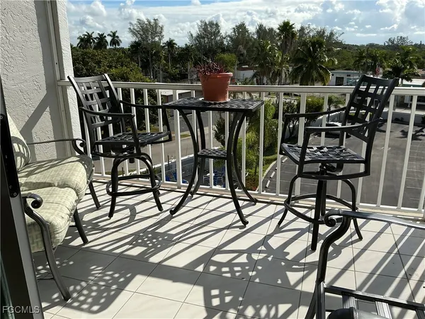 a view of a chairs and table on the terrace