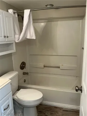 a view of hallway with wooden floor