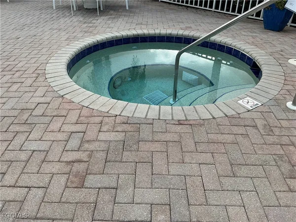 a view of a lake with a backyard