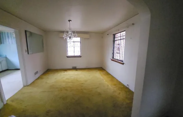 an empty room with windows