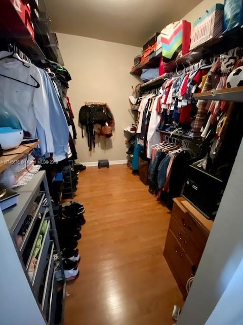 12999 Southwest 132nd Terrace, Unit 12999 Miami, FL 33186 - Photo 16 of 23 a view of a closet