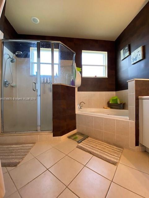 12999 Southwest 132nd Terrace, Unit 12999 Miami, FL 33186 - Photo 19 of 23 a bathroom with a tub shower and sink