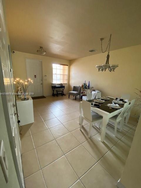 12999 Southwest 132nd Terrace, Unit 12999 Miami, FL 33186 - Photo 3 of 23 a kitchen with a sink and a stove top oven