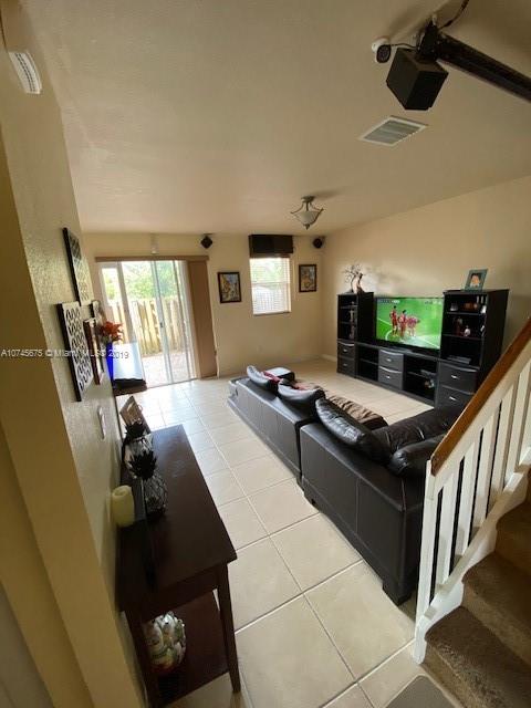 12999 Southwest 132nd Terrace, Unit 12999 Miami, FL 33186 - Photo 6 of 23 a kitchen with stove and cabinets