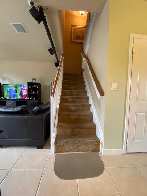 12999 Southwest 132nd Terrace, Unit 12999 Miami, FL 33186 - Photo 9 of 23 a view of entryway and hall