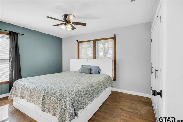 a bedroom with a bed and window