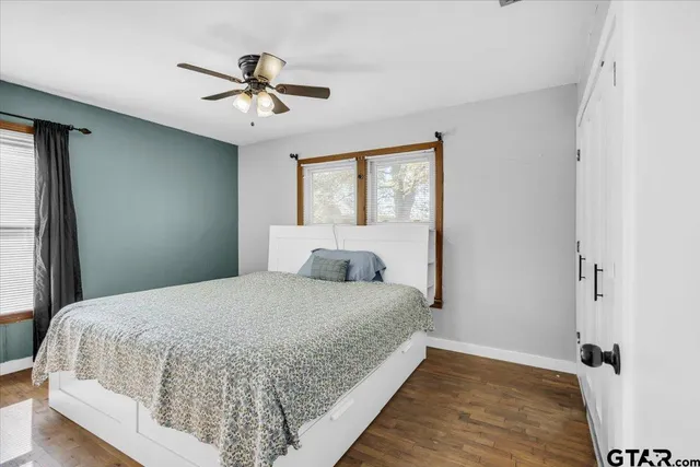 a bedroom with a bed and window