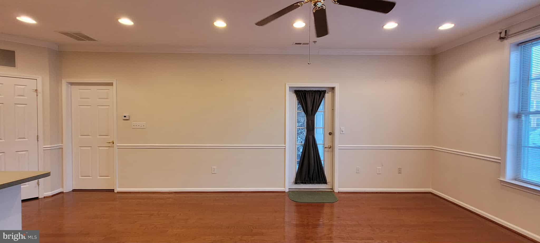 515 Highland Estates Clementon, NJ 08021 - Photo 14 of 25 an empty room with wooden floor and entrance