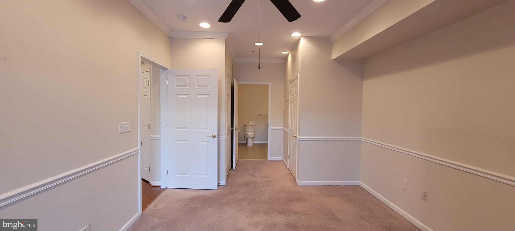 515 Highland Estates Clementon, NJ 08021 - Photo 17 of 25 an empty room with closet and a chandelier fan