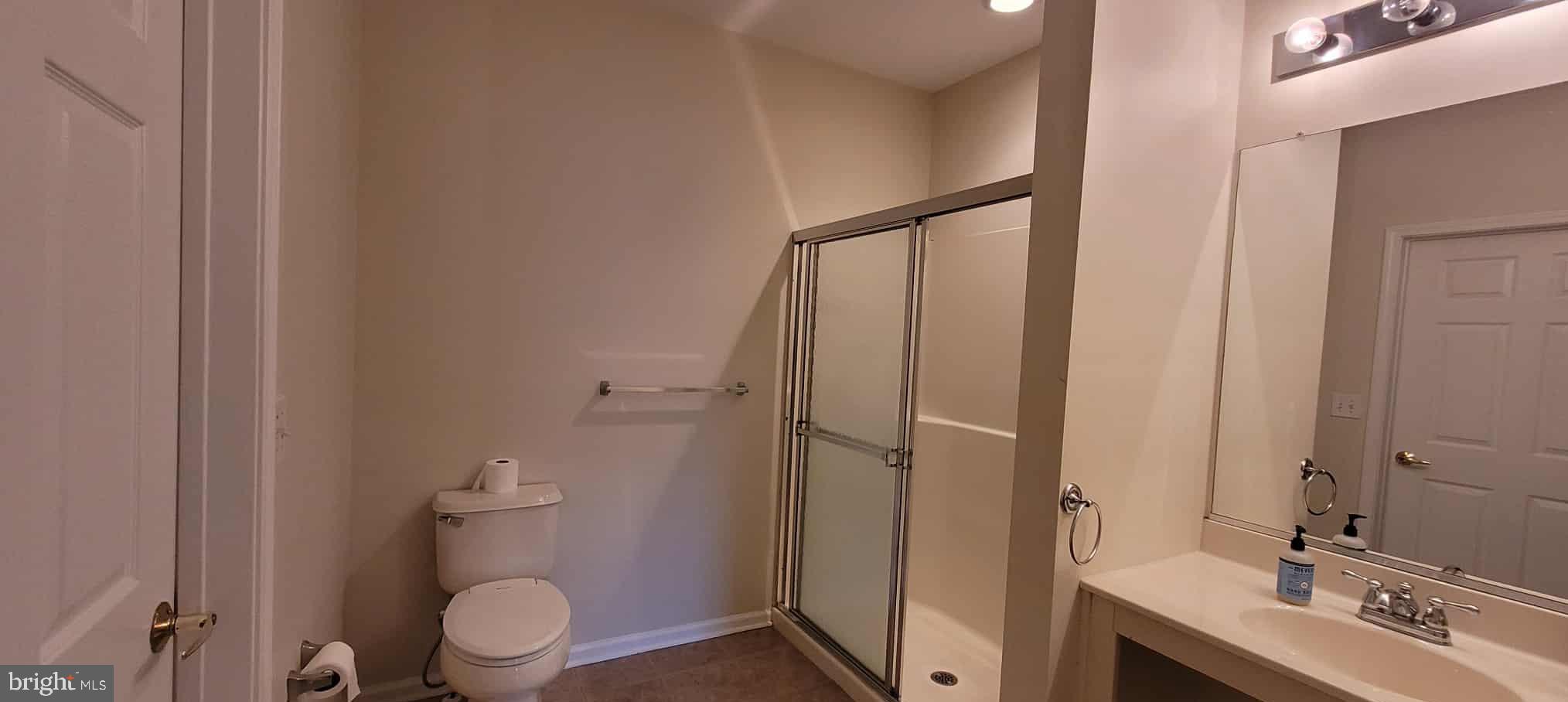 515 Highland Estates Clementon, NJ 08021 - Photo 24 of 25 a bathroom with a sink a toilet a mirror and shower