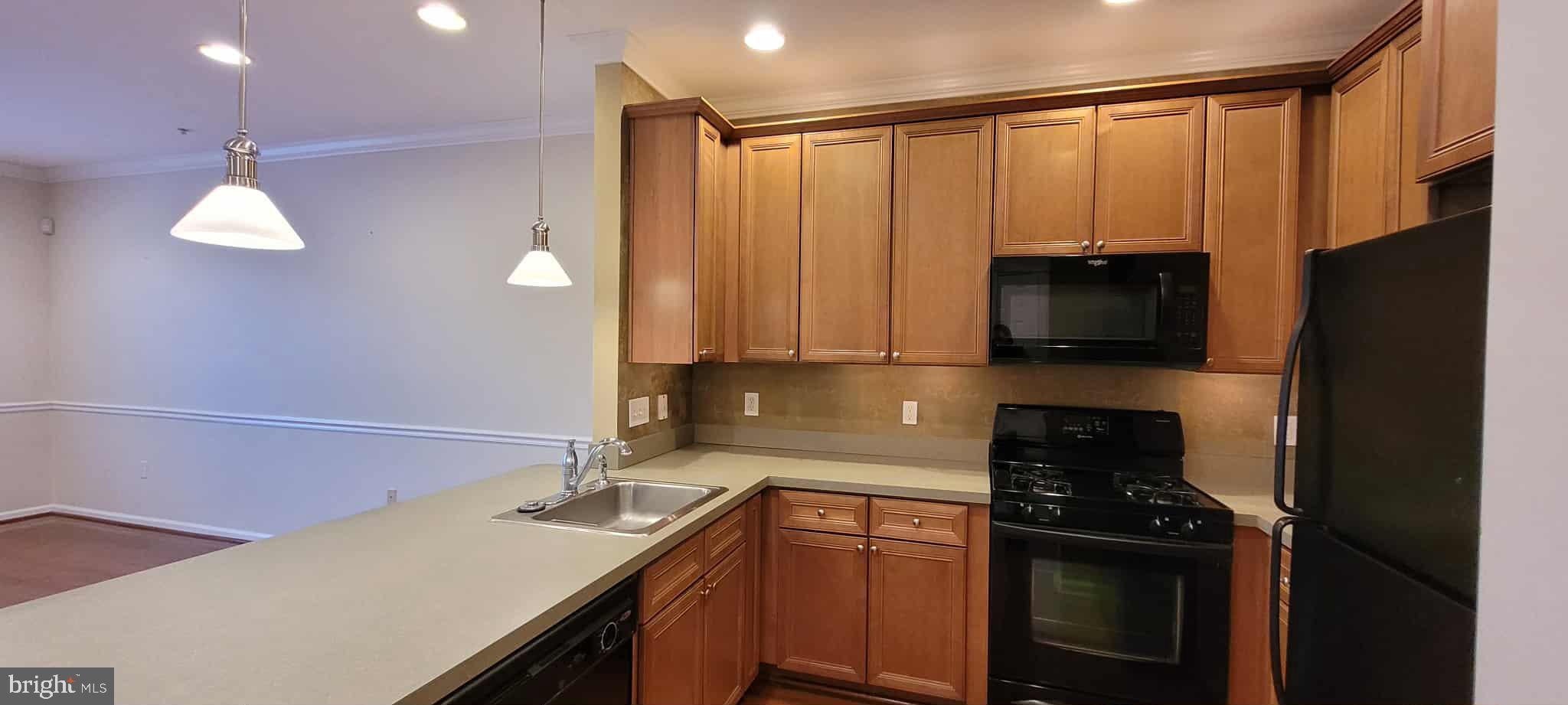 515 Highland Estates Clementon, NJ 08021 - Photo 7 of 25 a kitchen with a sink a counter top space cabinets and stainless steel appliances