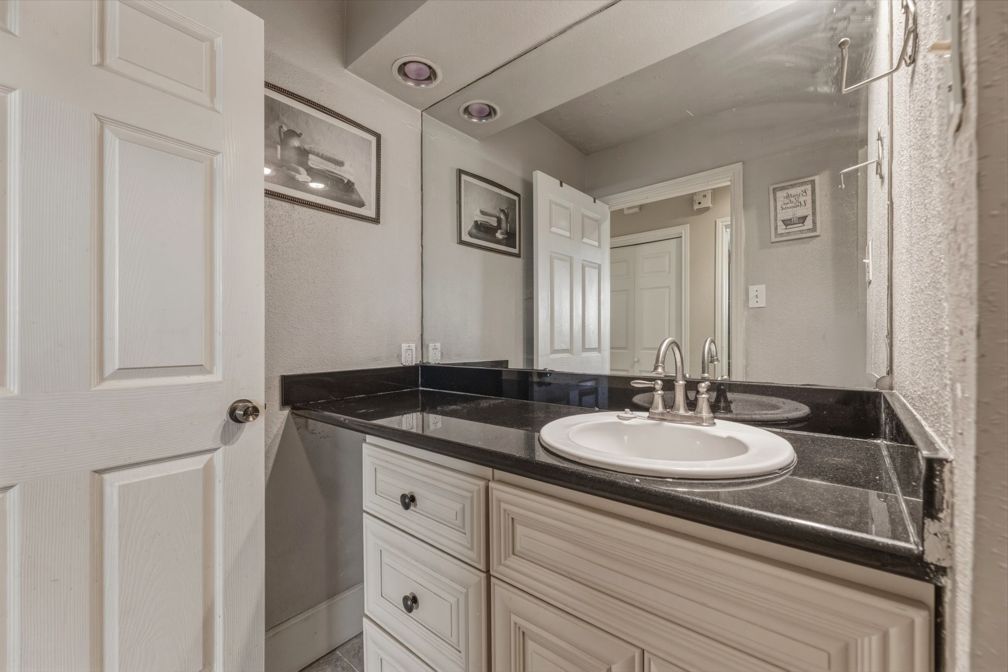 5211 Court Road Houston, TX 77053 - Photo 20 of 35 a bathroom with a granite countertop sink and a mirror