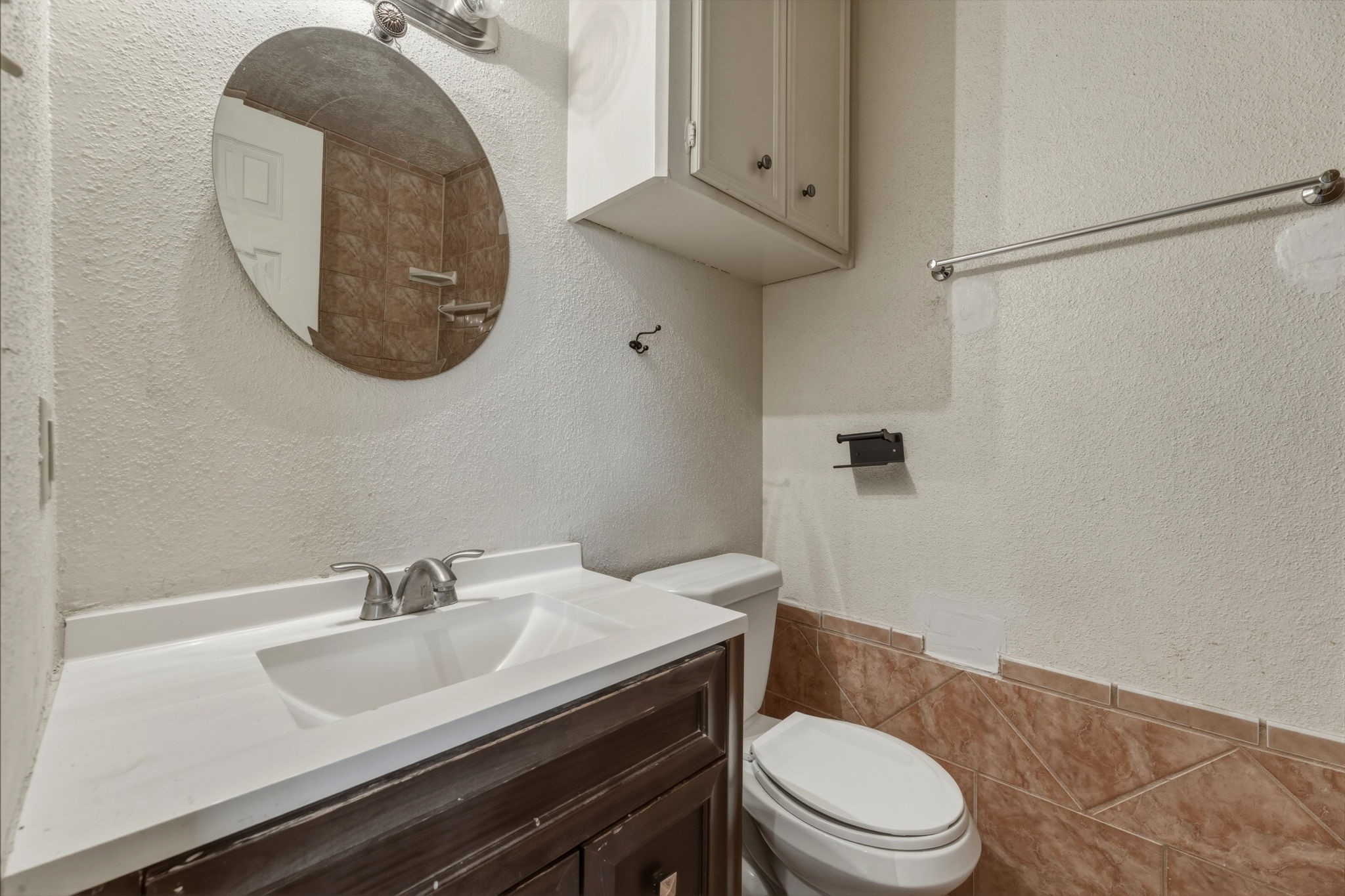 5211 Court Road Houston, TX 77053 - Photo 25 of 35 a bathroom with a sink a toilet and a mirror