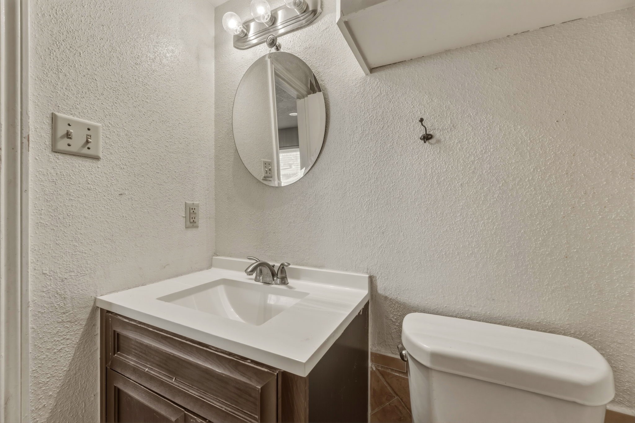5211 Court Road Houston, TX 77053 - Photo 26 of 35 a bathroom with a sink a toilet and a mirror