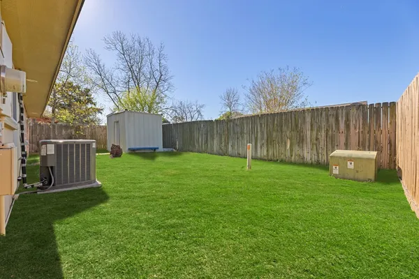 a view of a backyard with garden