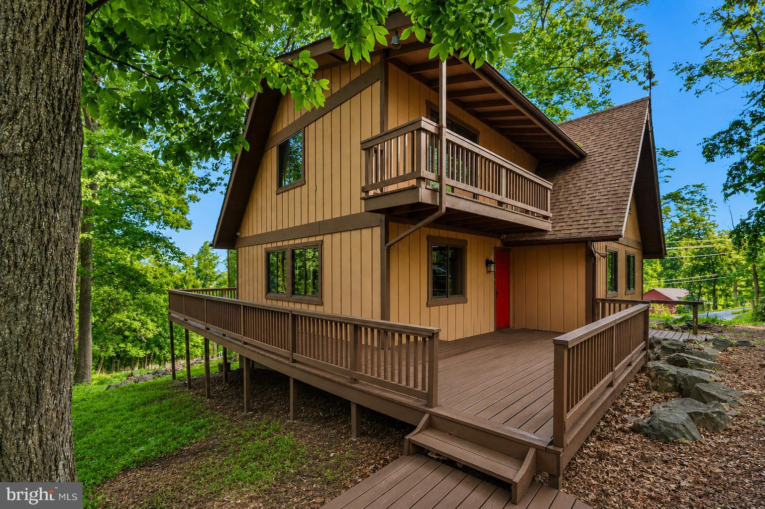 758 Club House Road Front Royal, VA 22630 - Photo 33 of 50 a view of a house with a yard and wooden deck