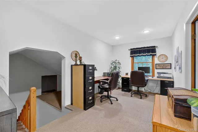 a view of a workspace with furniture