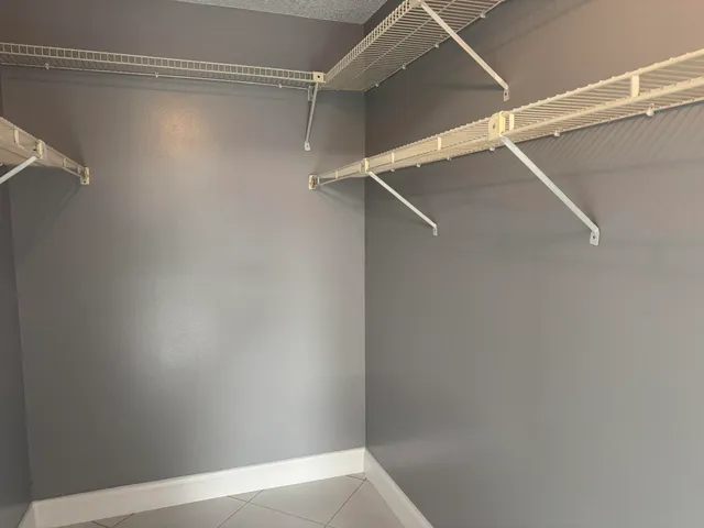a view of an empty walk in closet