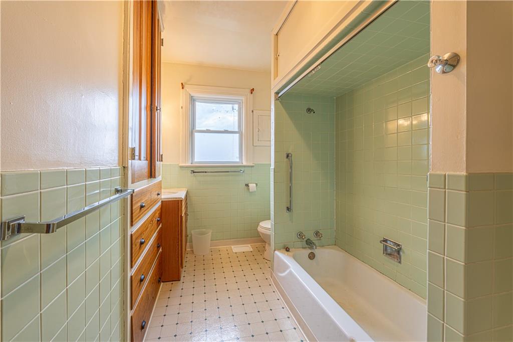 114 Union Street Uniontown, PA 15401 - Photo 11 of 28 a bathroom with a tub a sink and a shower
