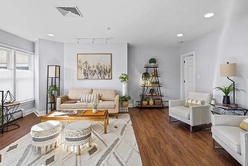1 Davenport Street, Unit 2 Cambridge, MA 02140 - Photo 2 of 13 a living room with furniture and wooden floor