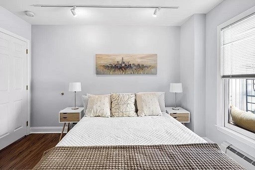 1 Davenport Street, Unit 2 Cambridge, MA 02140 - Photo 6 of 13 a bedroom with a bed and a window