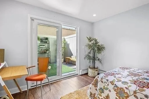 a room with furniture and a potted plant