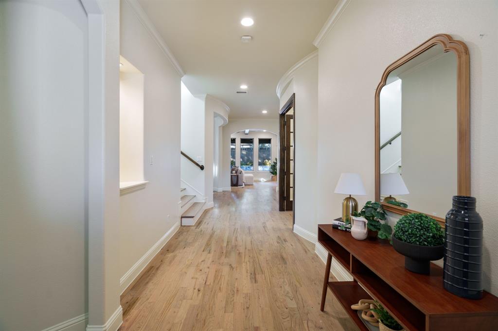 6211 Velasco Avenue Dallas, TX 75214 - Photo 11 of 38 a hallway with wooden floor and furniture