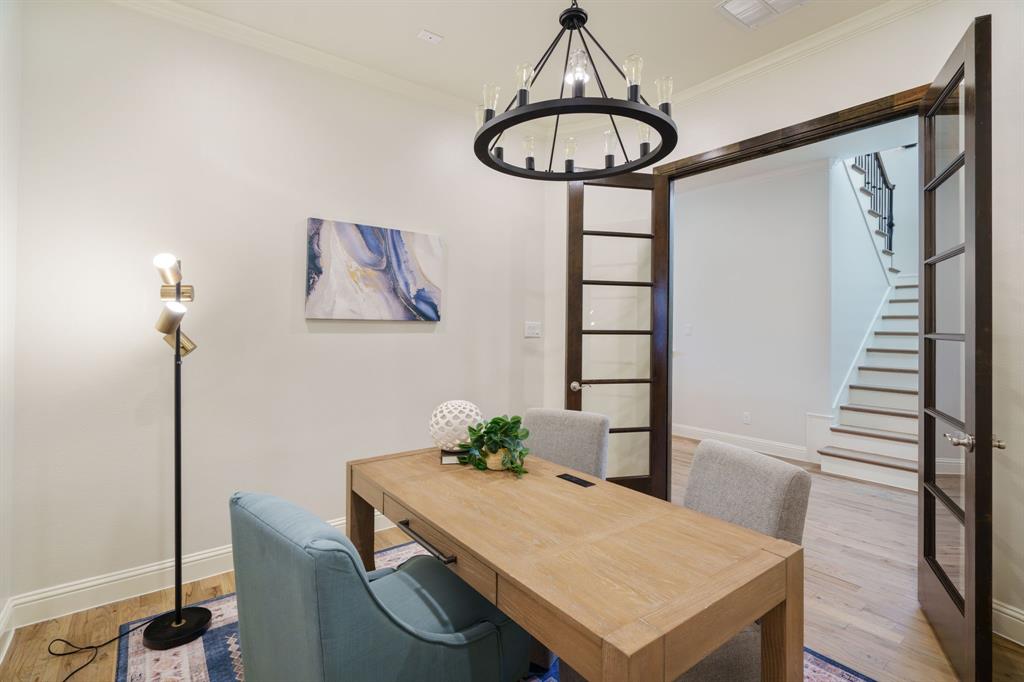 6211 Velasco Avenue Dallas, TX 75214 - Photo 13 of 38 a view of a dining room with furniture wooden floor and a chandelier