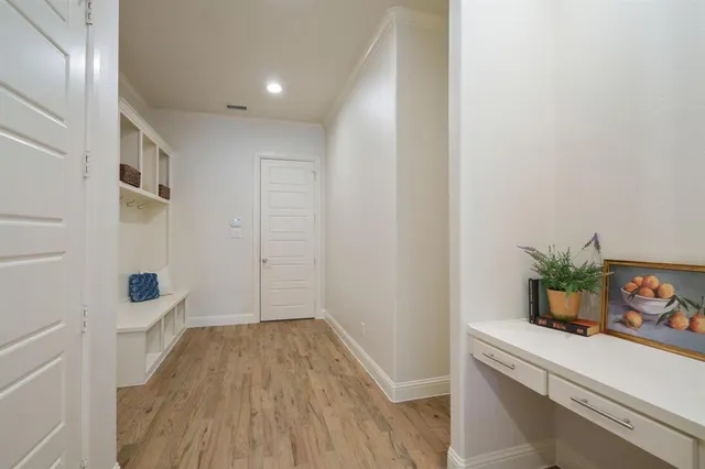 a view of an entryway with wooden floor