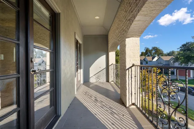 a view of a balcony with wooden floor