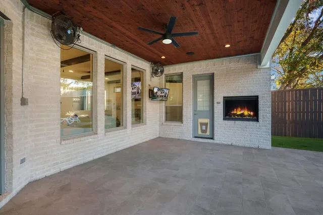 a view of a room with an empty room and fire place