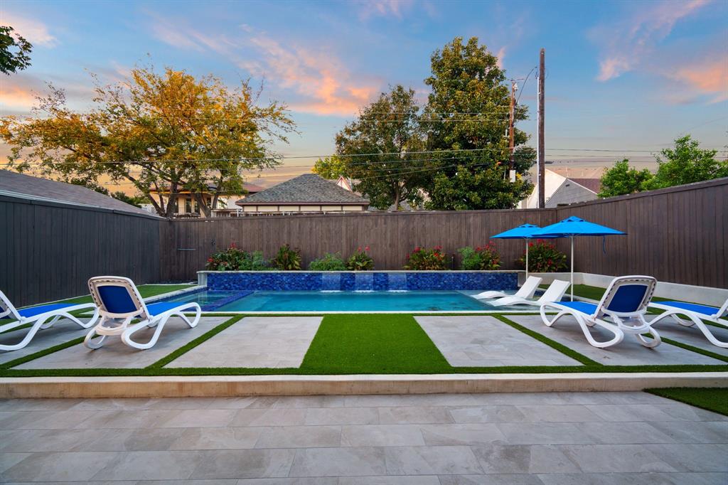 6211 Velasco Avenue Dallas, TX 75214 - Photo 29 of 38 a view of lawn chairs under an umbrella