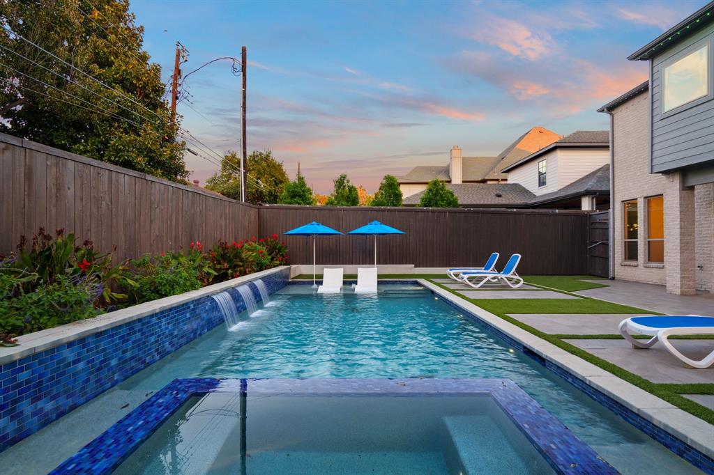 6211 Velasco Avenue Dallas, TX 75214 - Photo 31 of 38 a view of a swimming pool with a yard