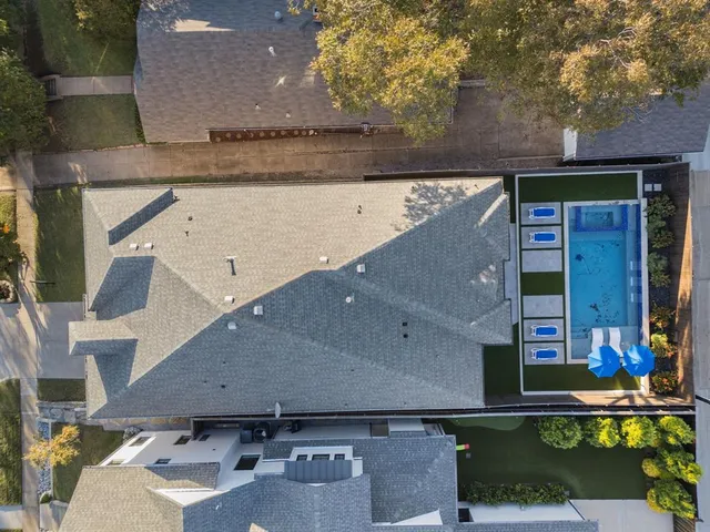 an aerial view of a house with swimming pool