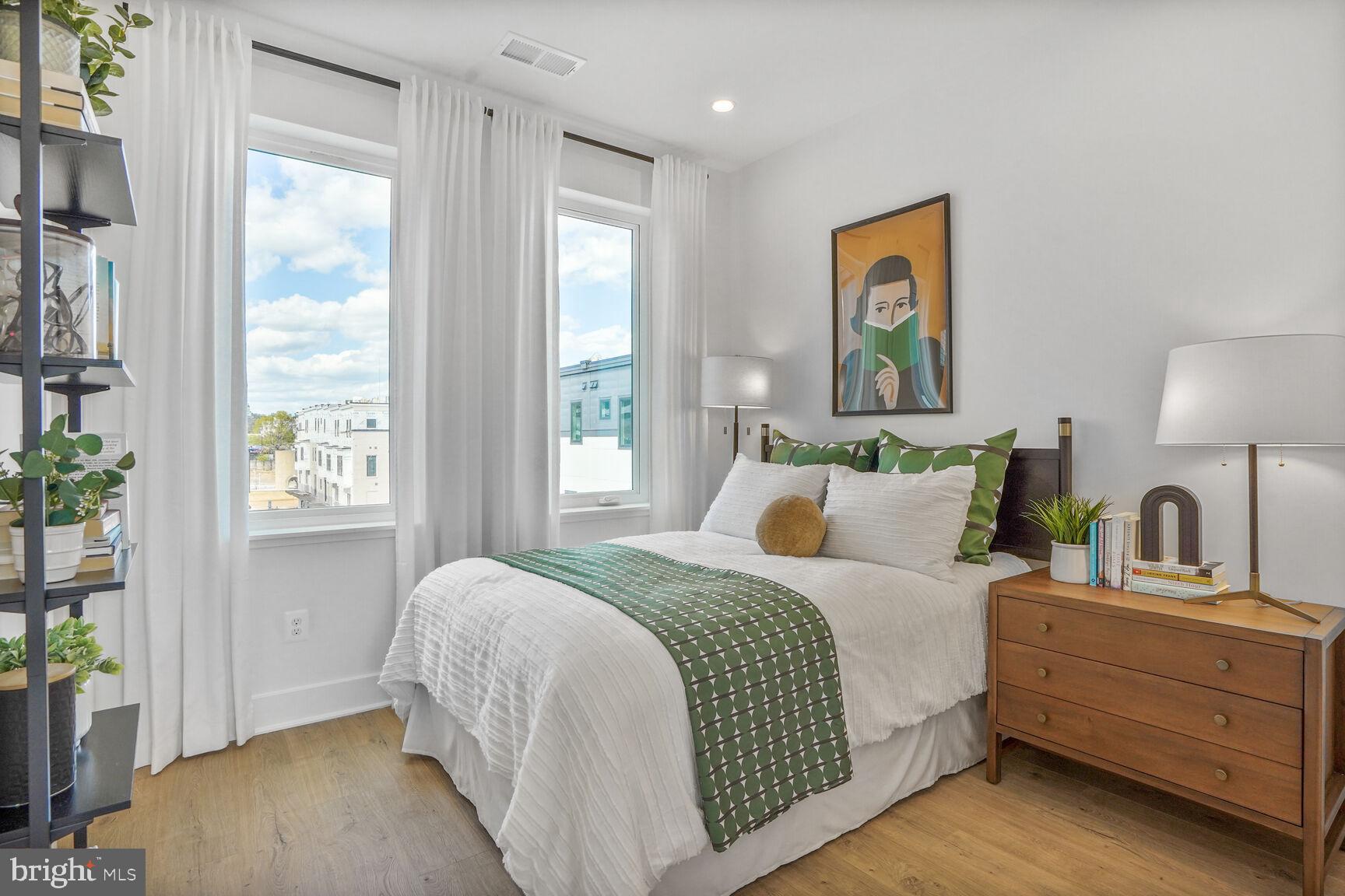 61 Lower Service Road Northwest, Unit 877 Washington, DC 20422 - Photo 11 of 21 a bedroom with a bed and window