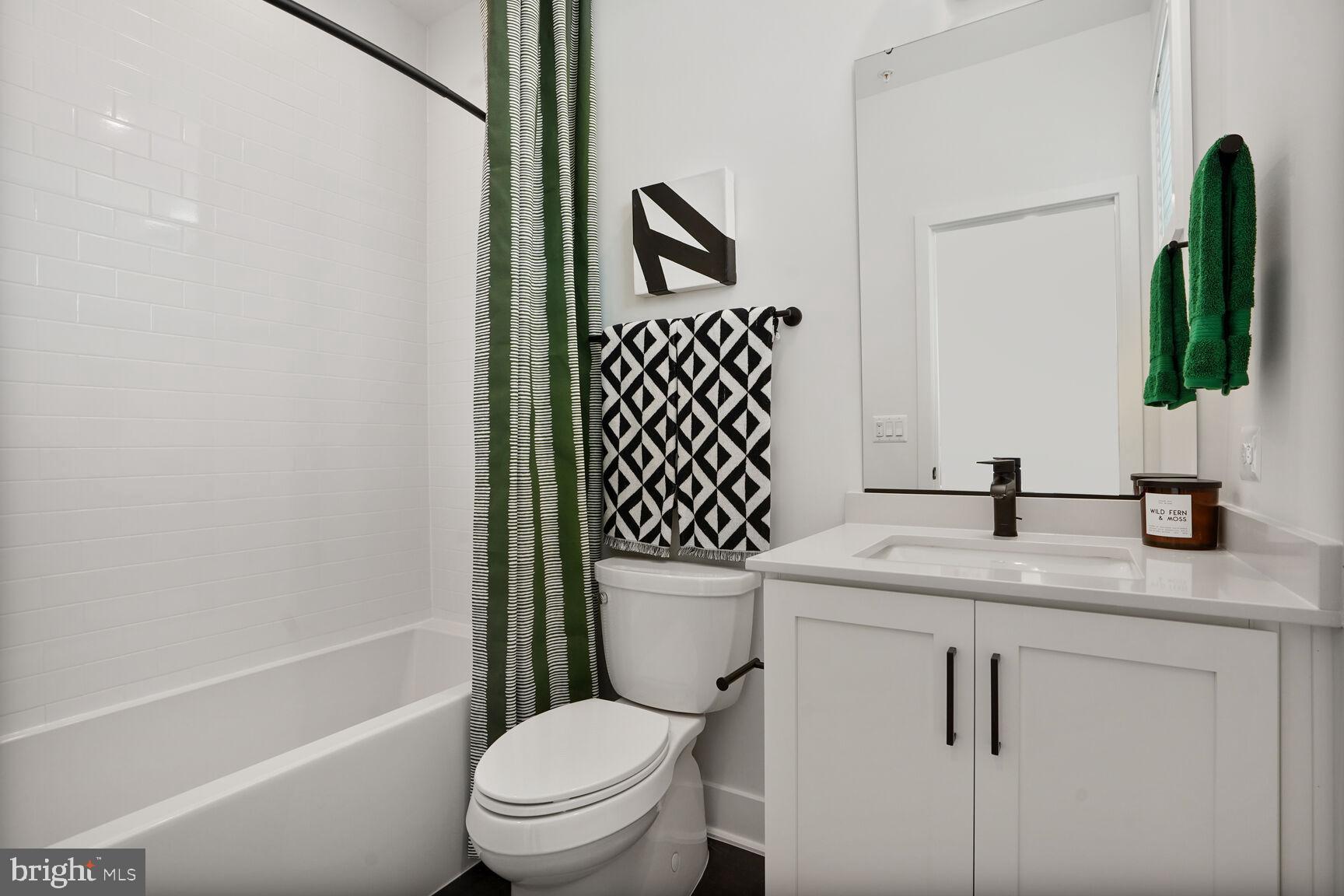 61 Lower Service Road Northwest, Unit 877 Washington, DC 20422 - Photo 15 of 21 a bathroom with a granite countertop sink toilet and shower