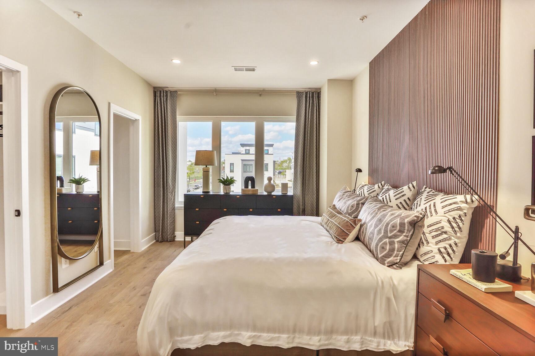 61 Lower Service Road Northwest, Unit 877 Washington, DC 20422 - Photo 20 of 21 a bedroom with a large bed and a window