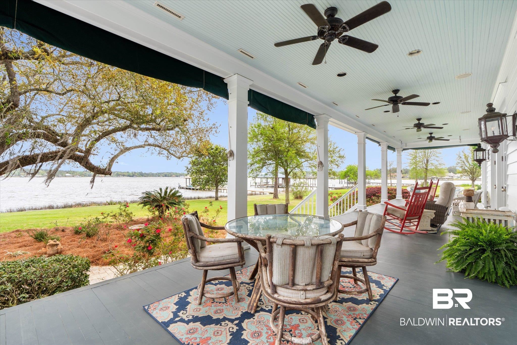 3500 Higgins Road Mobile, AL 36619 - Photo 35 of 54 View of patio featuring outdoor dining area, a ceiling fan, and a water view