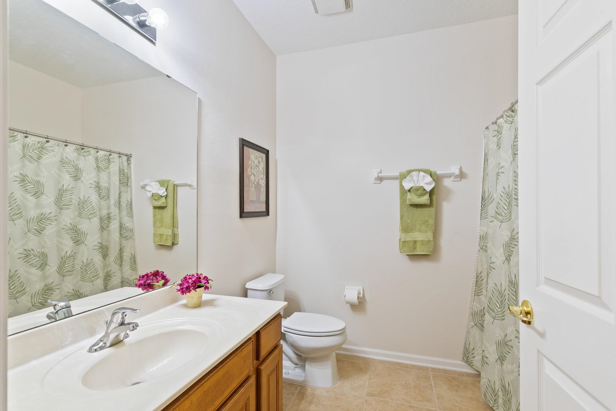 554 Wooded Crossing Circle St. Augustine, FL 32084 - Photo 11 of 43 a bathroom with a sink toilet and a mirror